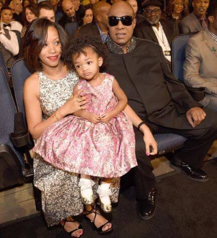 Tomeeka Robyn Bracy with her husband and daughter Nia.